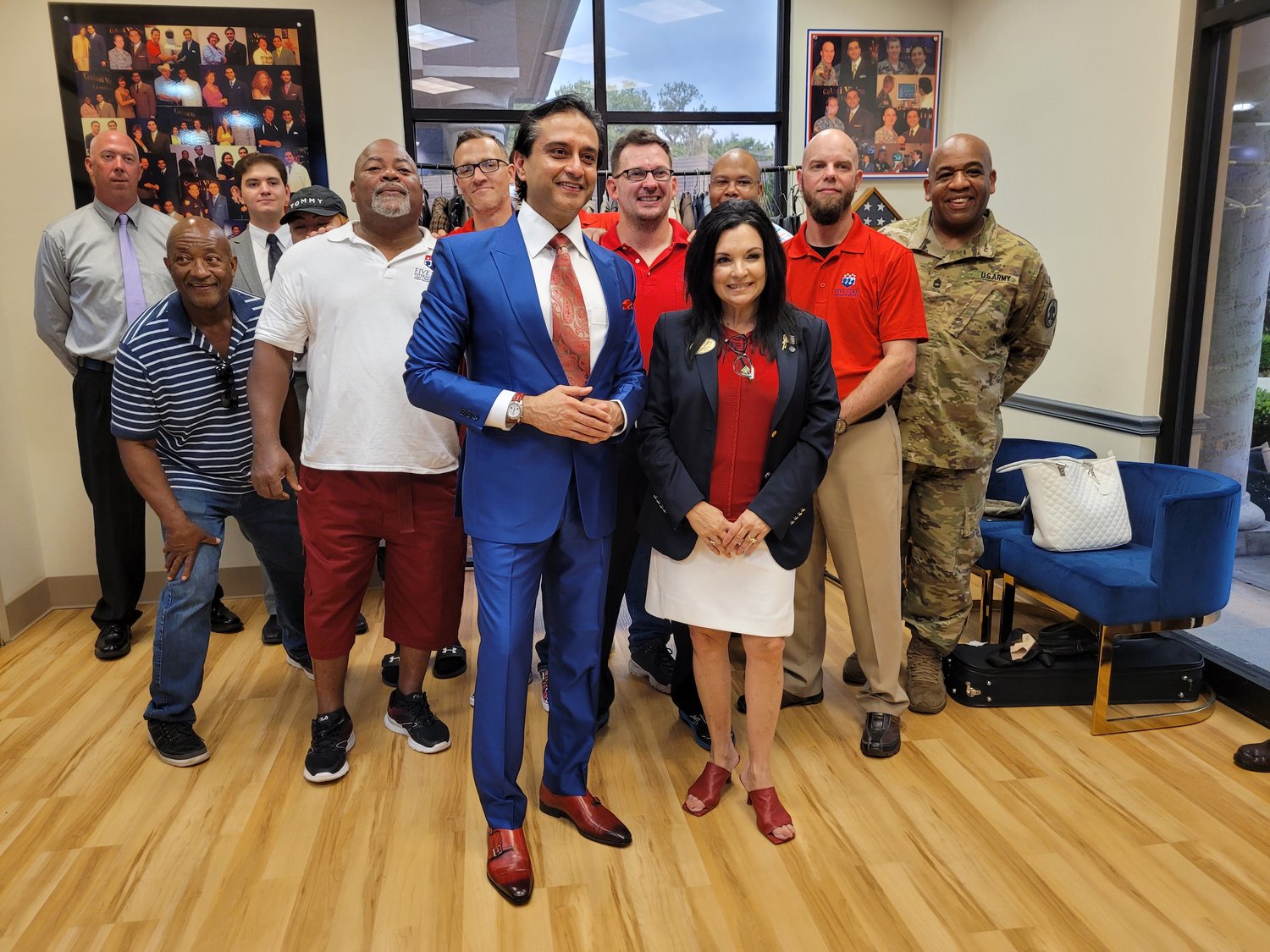The Cultural Center at Ponte Vedra Beach in partnership with the Gulani Vision Institute donated suits to local U.S. veteran organizations, individuals and artists reentering the workforce. Here, Cultural Center President and Executive Director Donna Guzzo and Dr. Arun Gulani stand with U.S. veterans receiving suits.